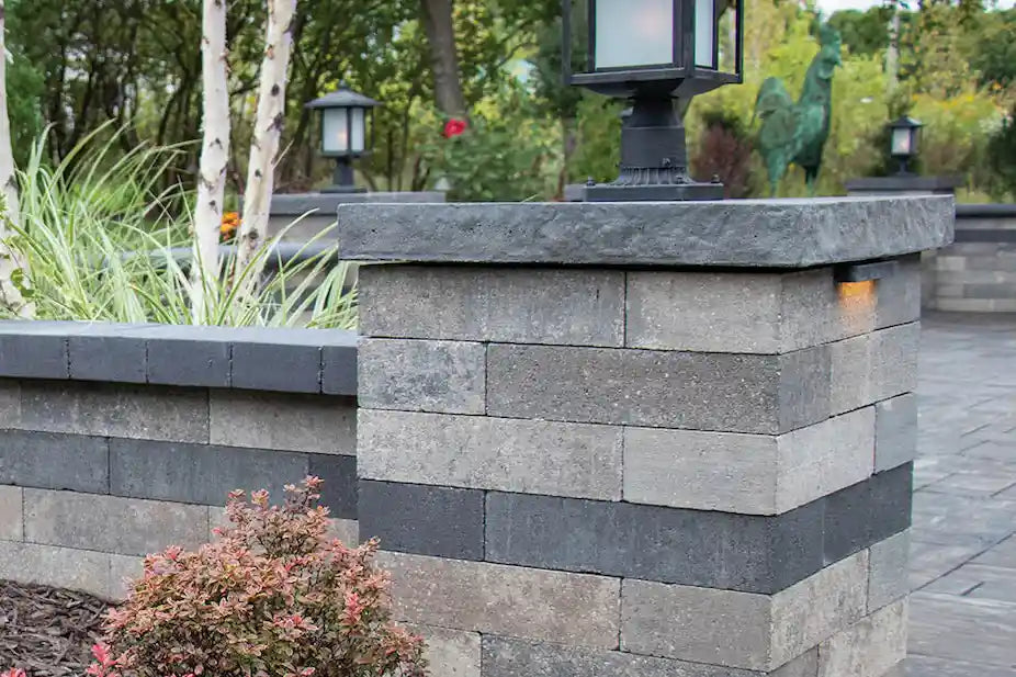 Pillar and freestanding wall with patio lantern on top.