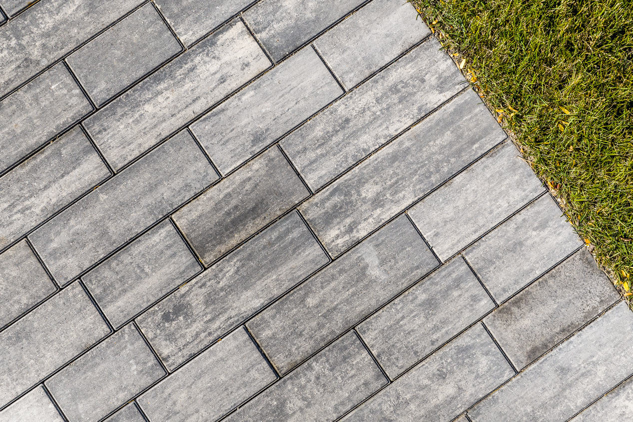 close up of a drive way that is built with Influence pavers