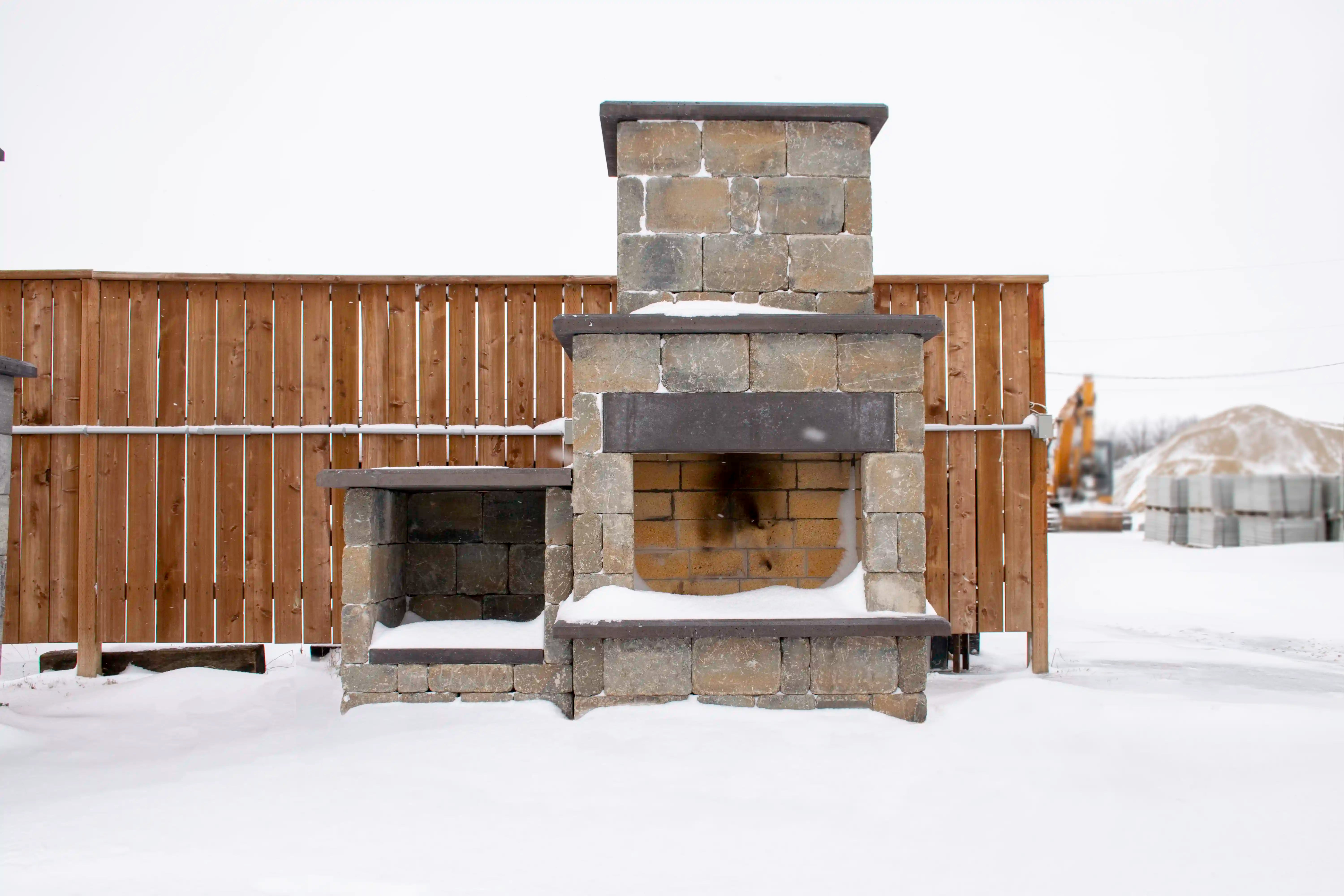 Rustic Lakeside Fireplace in Snow