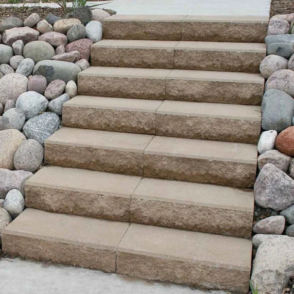 Walkway and a staircase made with Passageway Stepping Units surrounded by a rock bed and boulders