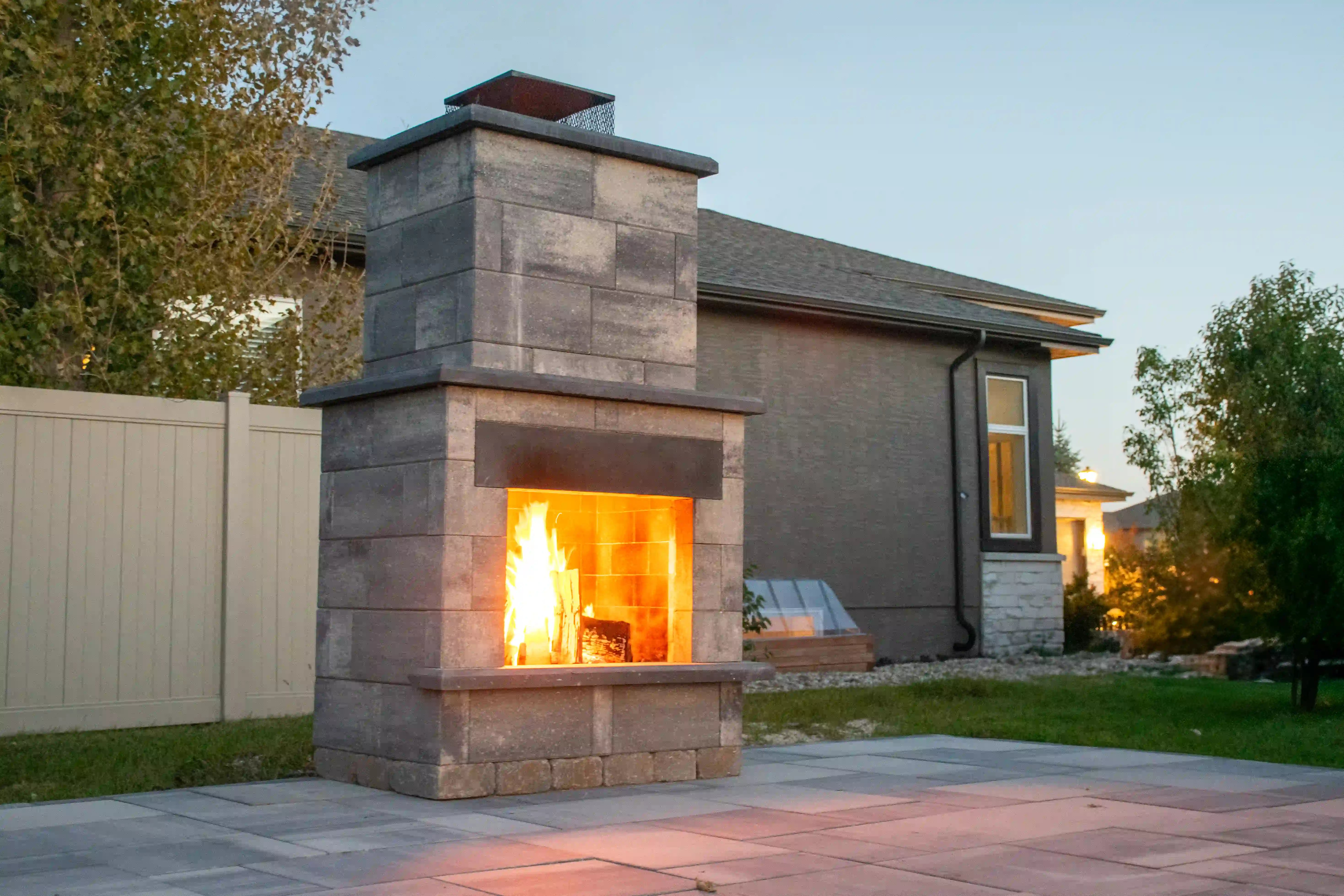 Smooth Metropolitan Fire Place in Majestic Grey and Obsidian accents in the snow.