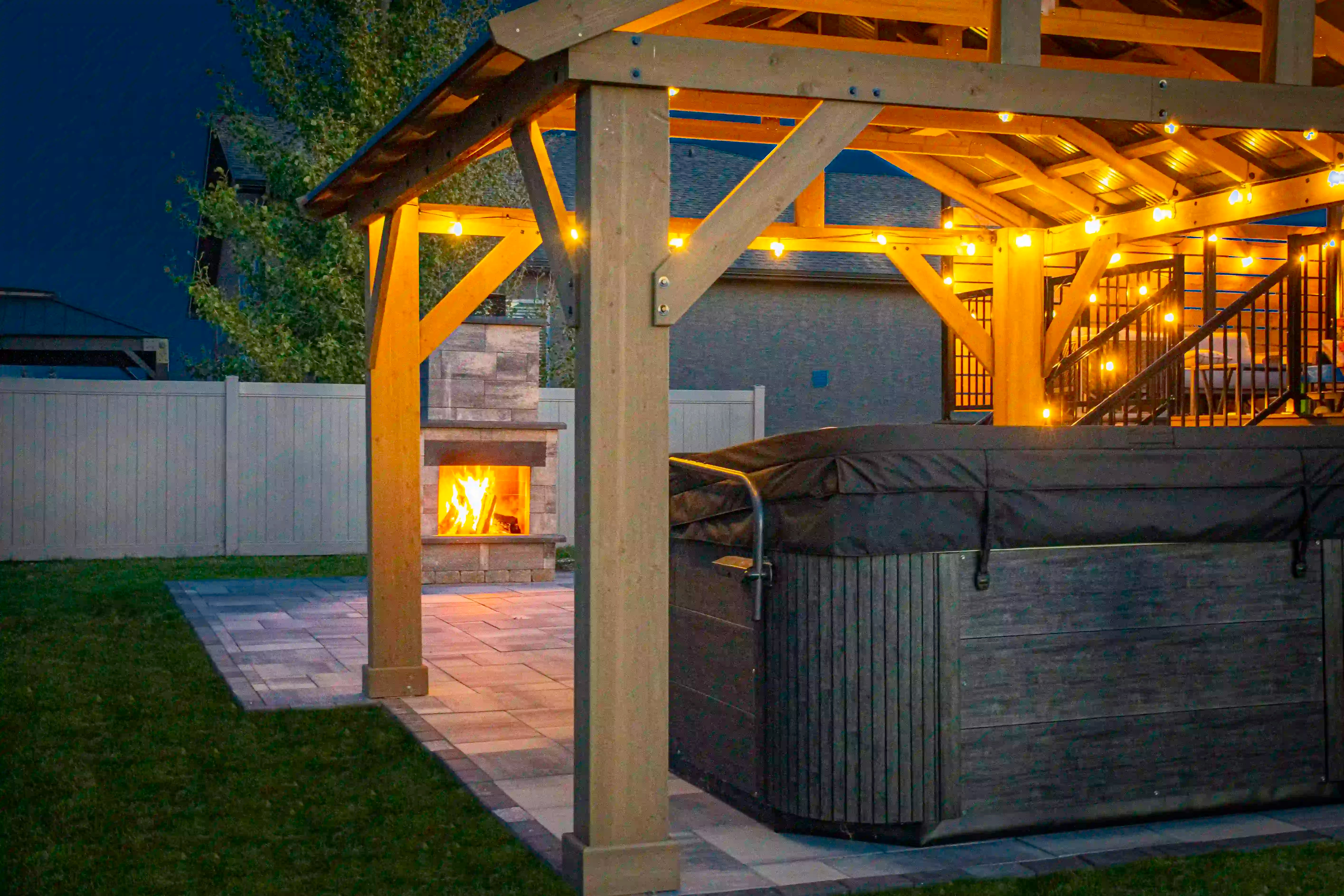 A small fire going inside the Smooth Metropolitan Fire Place with the firestone in the back.