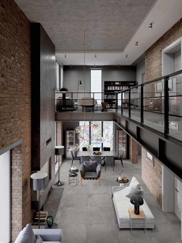 industrial style loft with grey concrete style porcelain pavers installed on the floor.