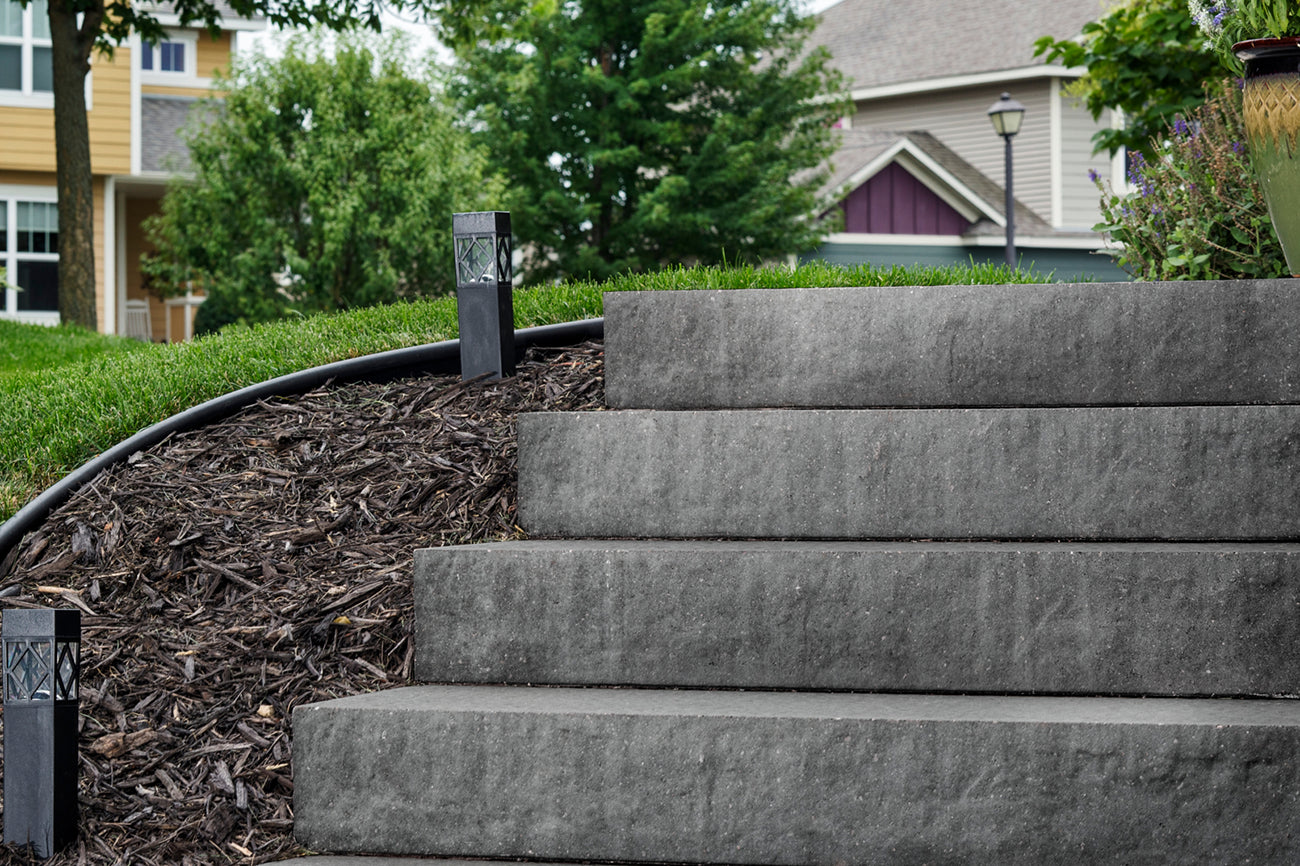 Multi-level patio built on a hill with stairways made with Passageways Stepping Units.