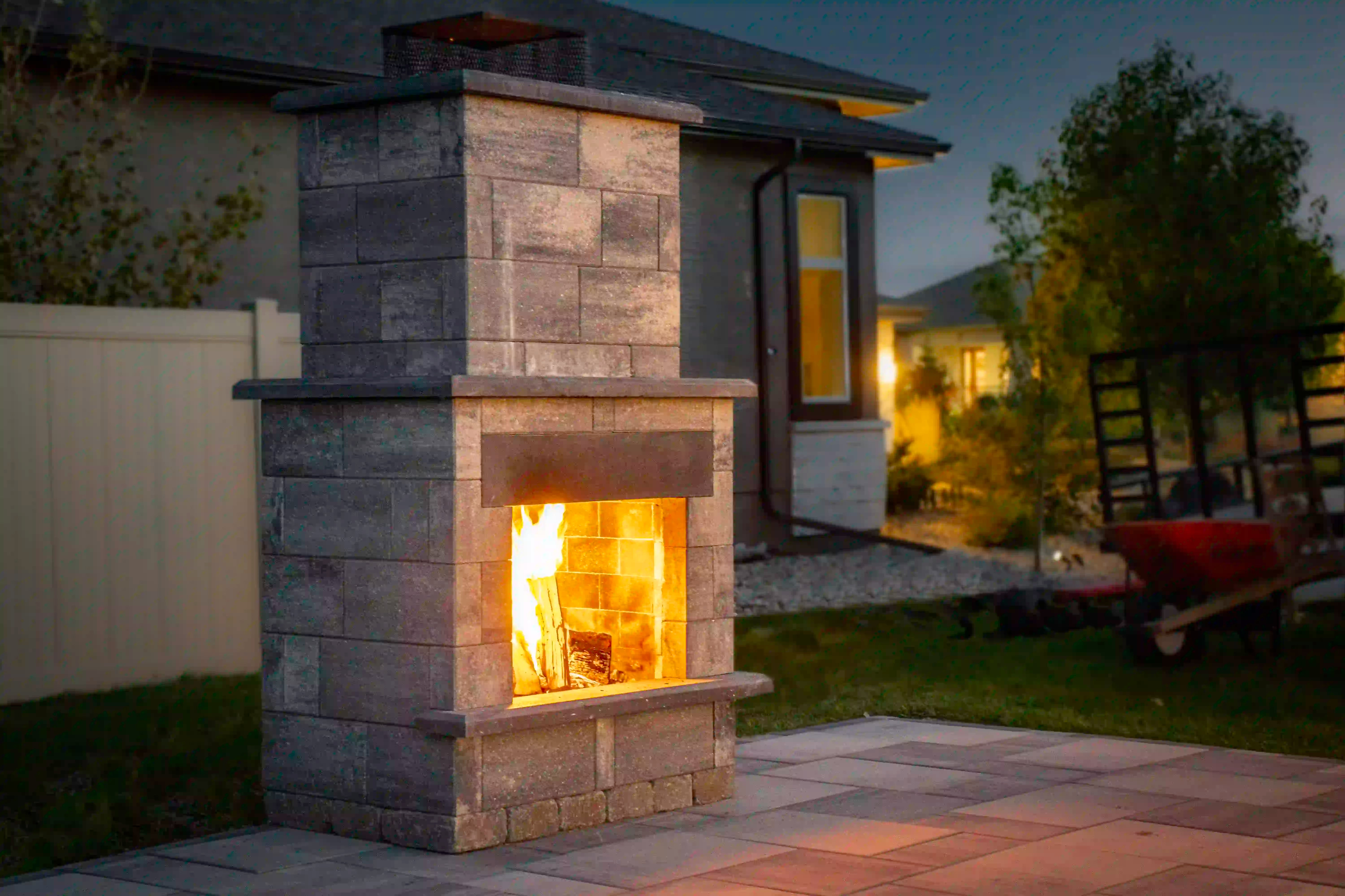 Smooth Metropolitan Fire Place in majestic grey and obsidian accents with a fire going inside.