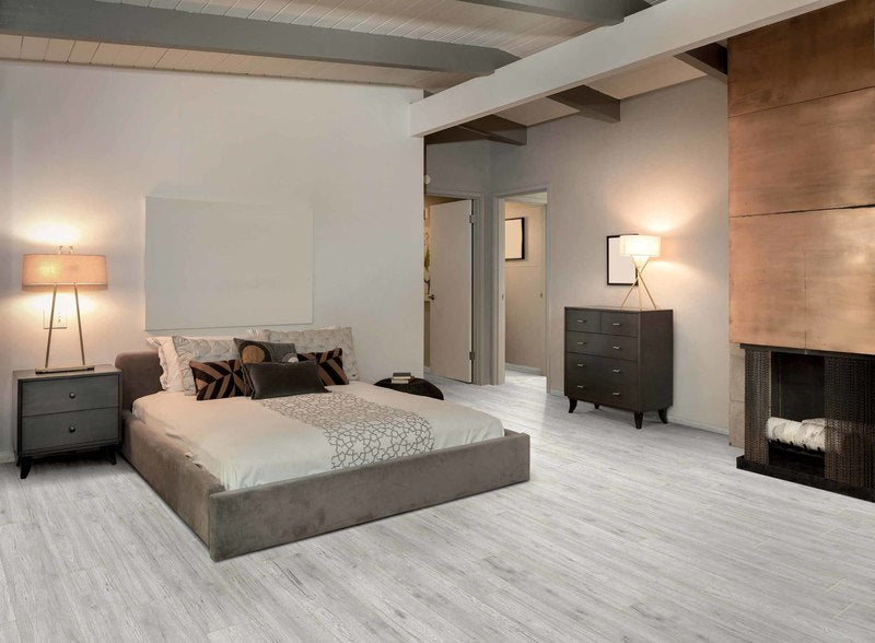 Modern Primary Bedroom with sierra wood look tiles installed on the floor.