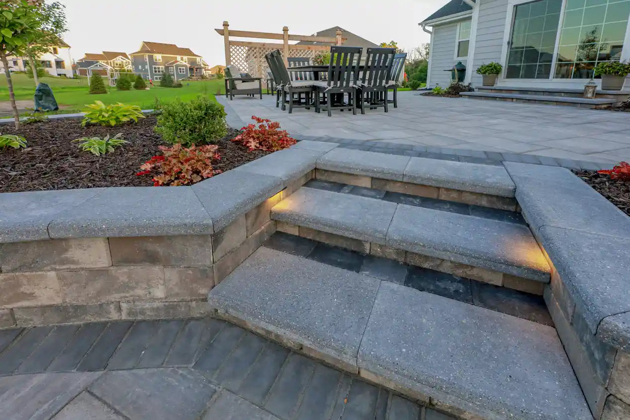 Prestige Coping used as a wall and stair cap on a backyard patio with a seating area and privacy Screen