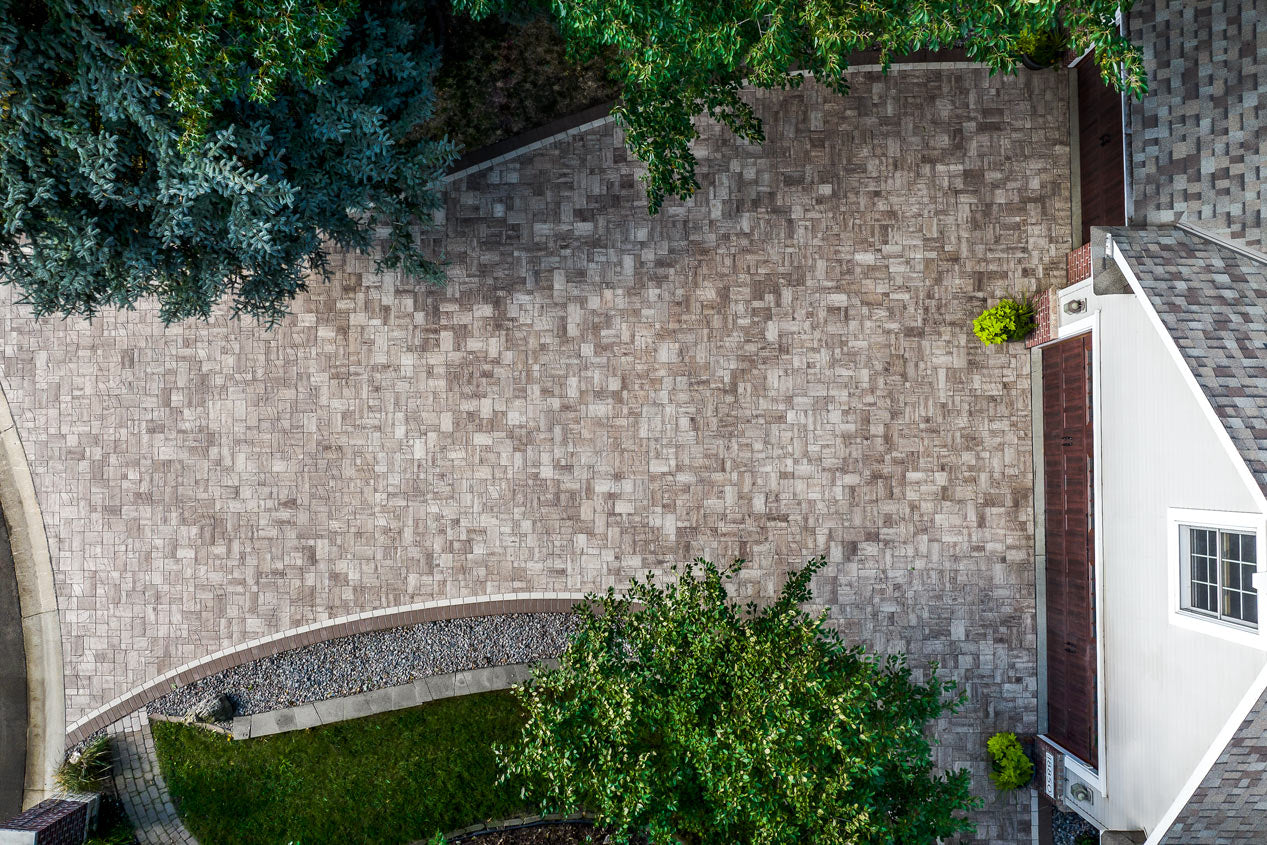Birds eye view of a driveway made with Vantage pavers with a double border