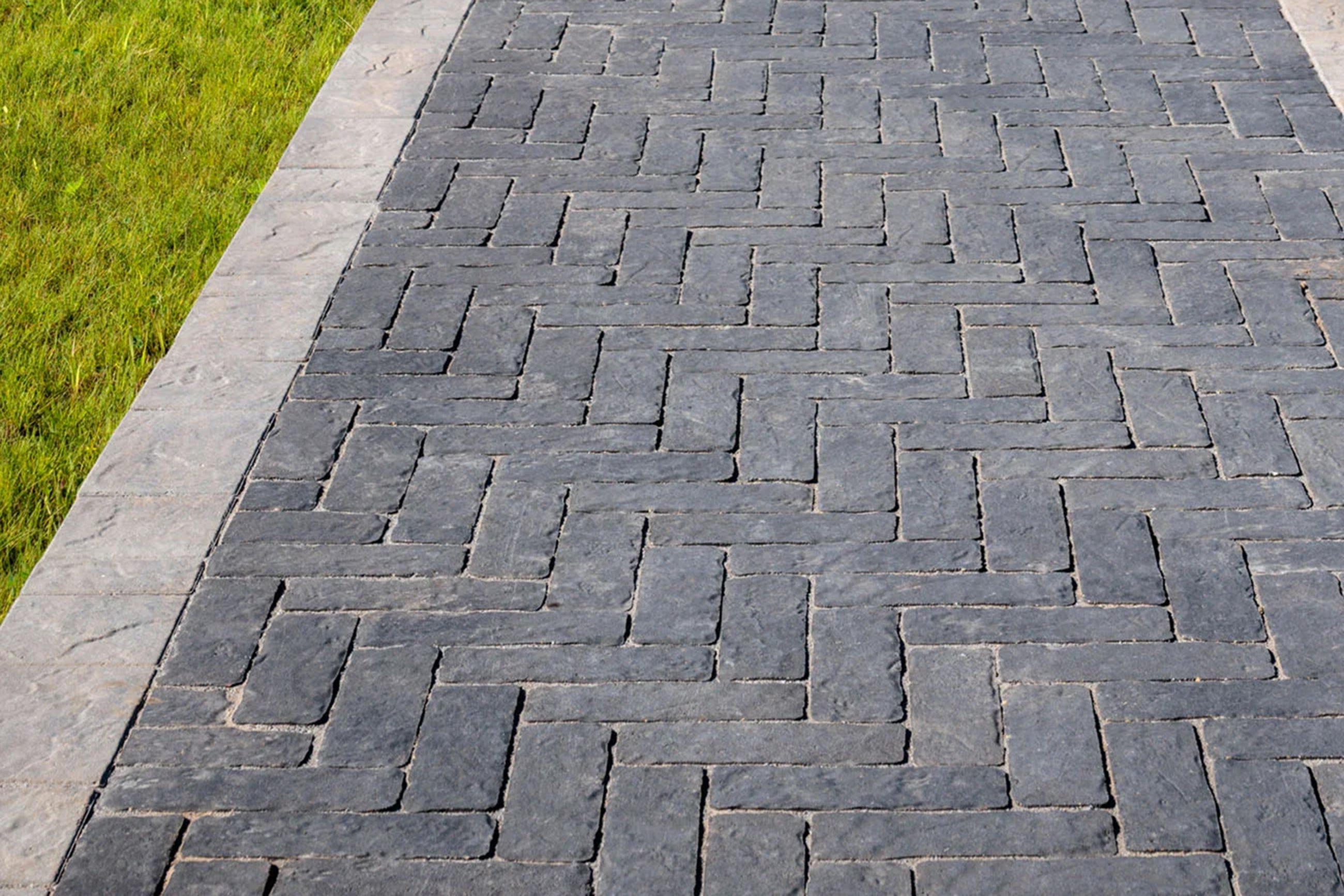 Walkway made with Brooklyn Pavers with a light colour boarder