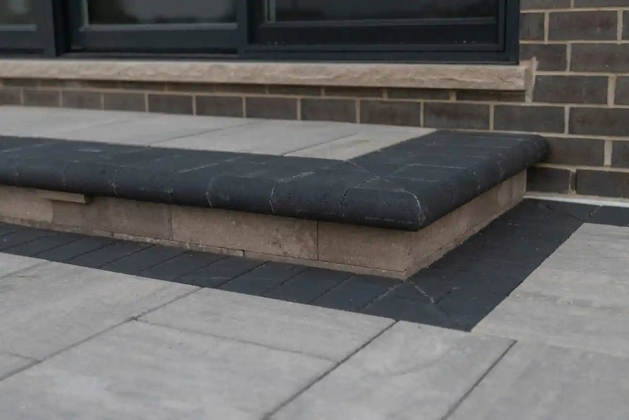 Grand Crest Coping used as stair edger that also matches the patio border in reflection.