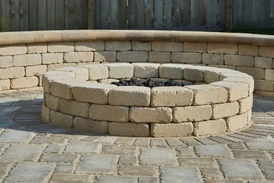 Retaining wall and fire pit made with Summit Wall Tapered Bricks on a patio