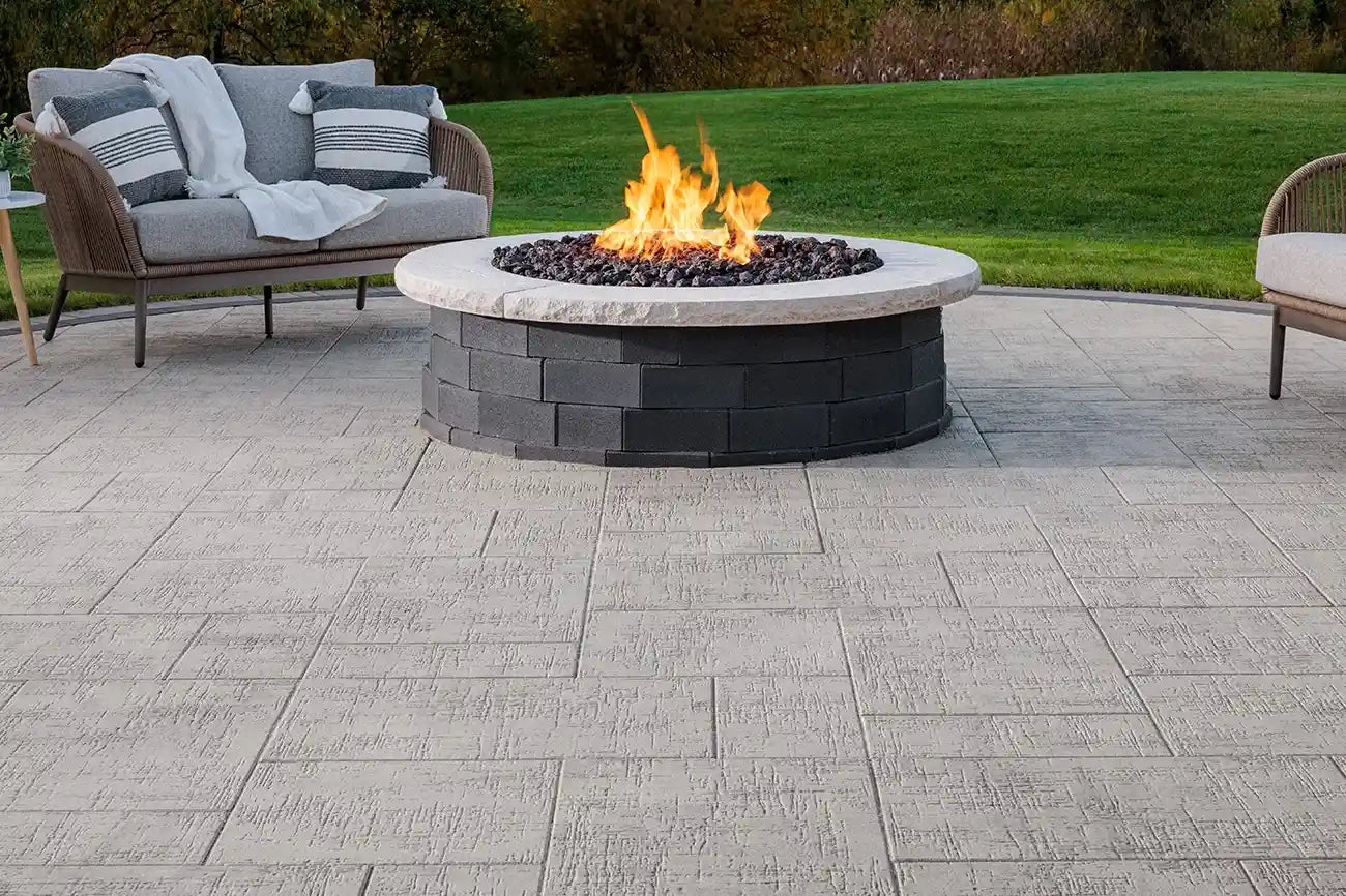 Summit Round Fire Pit on top of a patio made with Papyrus Pavers